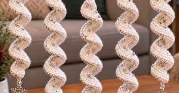 White crochet spiral Christmas ornaments with silver beads and snowflake charms