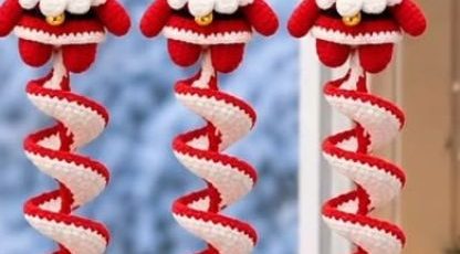 Hanging crochet Santa ornaments with red and white spirals
